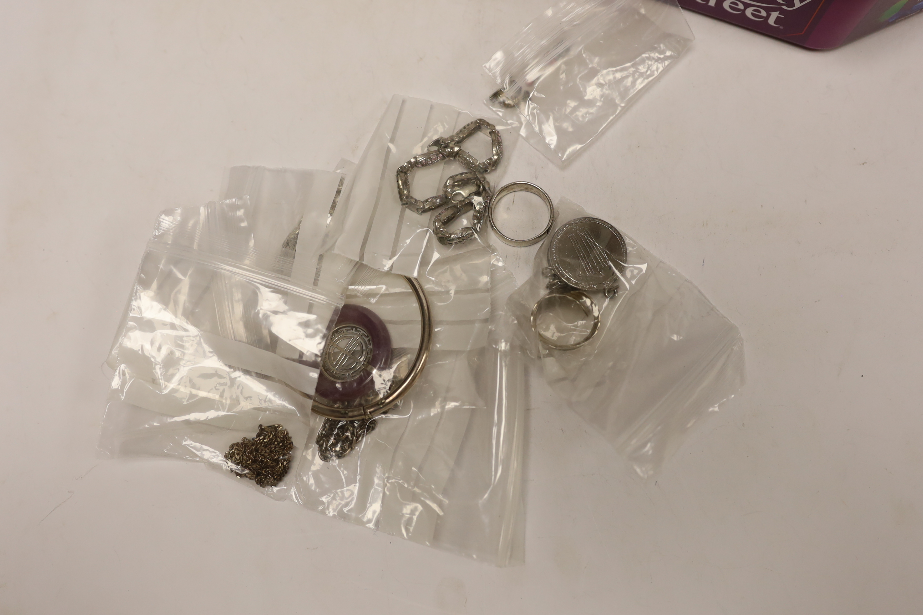 A large quantity of assorted silver, 925 and white metal jewellery including alberts, earrings, rings etc.